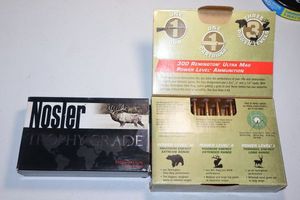 lot 43 image: 1 partial box of Remington 7mm ultra mag 175 gr. and 1 unopened box of Nosler 7mm Rum 160 gr.