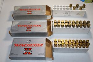 lot 50 image: Winchester ammo 1 box of 257 Roberts P 117 gr., 1 box 243 WSSM 100 gr., and 1 partial as shown