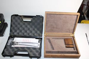 lot 74 image: Two pistol gun cases - one wood, one plastic