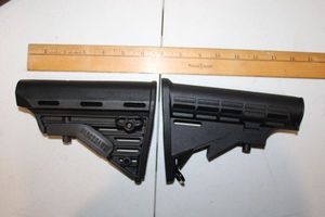 lot 86 image: Two pistol stabilizers as shown (one is Blackhawk) 