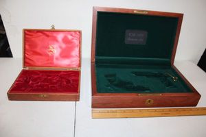 lot 99 image: Two wooden Colt pistol cases as shown