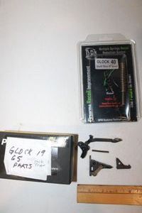 lot 259 image: Glock parts - Stock trigger and 10mm 6 barrel springs as shown