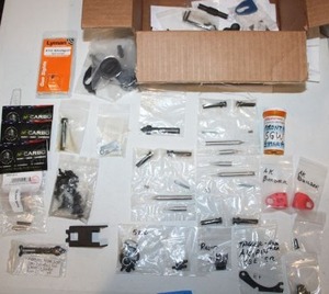 lot 284 image: Misc. gun parts with shotgun sight and Sear springs