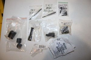 lot 312 image: SKS parts with cheek riser, and swivel mounts