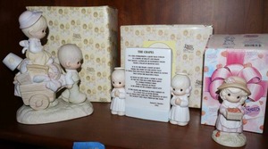 lot 17 image: Precious Moments figurines Walking by faith, On a hill overlooking a quiet blue stream, and Your the berry best