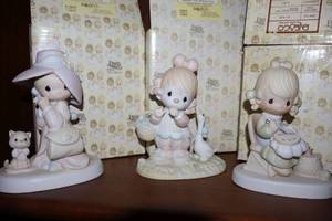 lot 19 image: Precious Moments figurines To a very special mom, Waddle I do without you, Mother needle point