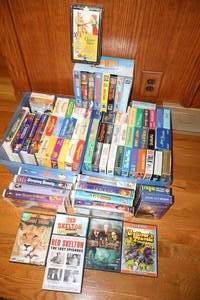 lot 82 image: Movies mostly VHS (some Disney and John Wayne), some DVDs, see photos