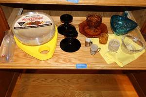lot 137 image: Amber glass, Blue glass dish with lid, Black candle holders, plastic luncheon plates and holders, and more