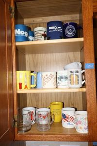 lot 109 image: Coffee mugs and koozies
