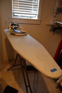 lot 258 image: Ironing board and two irons