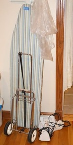 lot 269 image: Ironing board, luggage dolly, and clothes irons