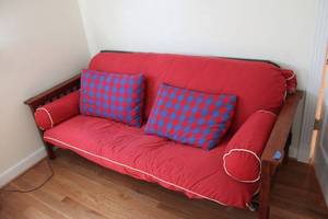 lot 283 image: Red futon couch bed