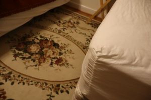 lot 296 image: Ivory and floral area rug