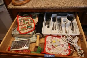 lot 123 image: Flatware with tray, rolling pin and hot pads