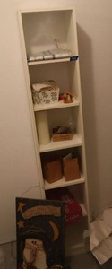 lot 365 image: White shelf unit with contents as shown