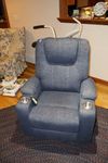 Blue upholstered lift chair with massage and heat feature.