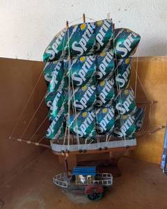 lot 9 image: Model Ship Crafted from Sprite Cans and Smaller Ship