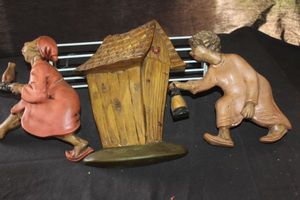 lot 39 image: Vintage Arnells Ceramic Wall Hangings Known as Race to the Outhouse