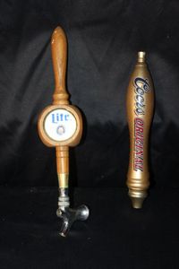 lot 102 image: Vintage Wooden Tap Handles for Miller Lite and Coors Original Beer