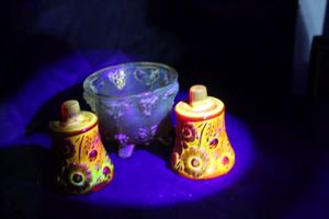 lot 107 image: Vintage Amberina Glass Candle Holders alside a decorative glass bowl some of which may contain boron Nite