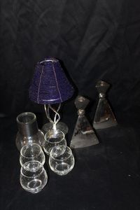 lot 110 image: Seven Vintage Candle Holders, and a vase