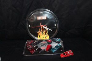 lot 114 image: Collectible Hot Rod Magazine Flames Clock, Hot Wheels, Legends Boyd Coddington Custom Rods 4 car Set and Maisto Utility Truck Fire Department diecast