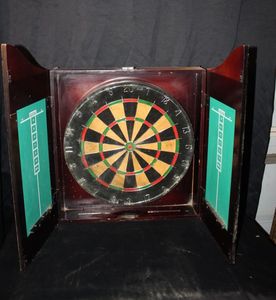lot 131 image: Wall Mounted wooden cabinet containing a traditional dartboards with built in scoreboard