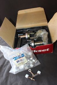 lot 142 image: Kwikset door hardware component and Ever Bilt hinge pin door stops