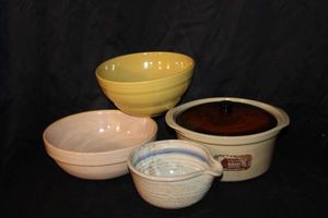 lot 159 image: Collection of Vintage Yellowware pottery bowls and covered stoneware baker