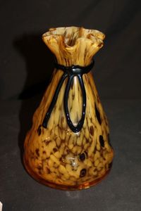 lot 173 image: vintage art glass round vase designed to look like a tied bag with amber, caramel, and black colors, Murano-style purse vase.&nbsp