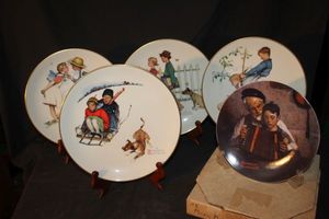 lot 209 image: Five Vintage Collectible plates featuring various Four Seasons and Young Love illustrations by Norman Rockwall, manufactured by Gorham Fine China