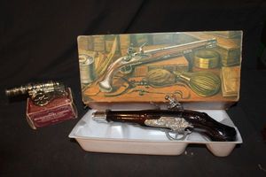 lot 196 image: Avon Decanter, Dueling Pistol 1760 and avon Revolutionary Cannon after shave in orginial packaging