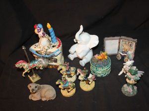 lot 214 image: Variety of ceramic collectables, baby white elephant, white unicorn, several carousel horses, tea light holder slice of birthday cake, green frog and trinket box