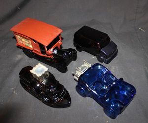 lot 226 image: Four Vintage Avon Decanters Amber Brown Steamboat side wheeler Aftershave decanter, Cobalt Blue Dune Buggy Aftershave decanter, County Vendor 1970s antique truck, Vantasic a Custom Van originally containing Wild Country Aftershave.