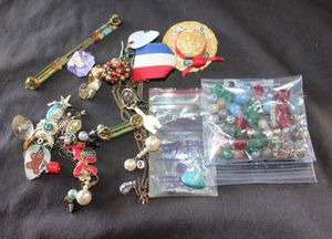lot 261 image: Vintage Fashion Jewelry Beads for two broken bracelets, mateless earrings, Necklace with pendant, Stone needs reattached and other fashion jewelry.
