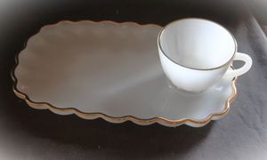 lot 280 image: Vintage Anchor Hocking Fire King Milk glass Snack Set with Scalloped edge Plate and a Matching cup. Trimmed in 22K Gold, Four Sets