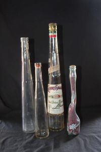 lot 288 image: Four vintage Clear Glass collectible bottles used for home decor