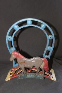 lot 17 image: Antique Decorative Cast Iron Hose Holder