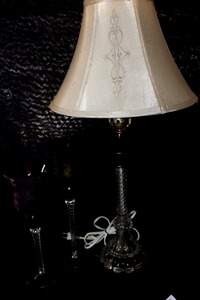 lot 327 image: 19th Century American twisted cranberry glass column lamp, featuring a clear glass twisted stem and a red glass font.&nbsp See Below for more details