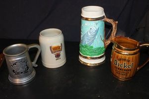 lot 324 image: Four Collectible Decorative Beer Steins, featuring a pewter stein, ceramic stein, painted fish scene and pitcher branded for George Dickel Tennessee Whiskey