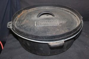 lot 305 image: Outdoor Gear Cast Iron camp Dutch Oven Heavy cooking pot designed for outdoor use over a campfire or charcoal. Pre-Seasoned