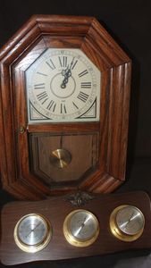 lot 323 image: Vintage Howard Miller Wall clock, featuring, wood frame, pendulum and Roman numerals on the dial, traditional chime sequence, and Springfield instrument company wood-mounted weather station featuring, thermometer, barometer and hygrometer.