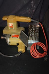lot 307 image: Collection of vintage Power tools likely from the 1960s-1970s featuring a black &amp decker branded finishing sander and matvhing 14 drill and selection of drill bits