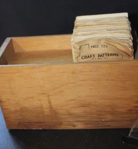 lot 310 image: Vintage Wooden Pattern Box with a Collection of Craft Patterns published by A. Neely Hall Productions. These were popular in the early-to-mid 20th century for woodworking, crafts, and various DIY projects