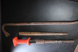 lot 356 image: A Collection of industrial metal tools, PryWrecking Bar, Tapered Alignment Bar. Reminton Model 476 Powder actuated fastening tool often called a power hammer.