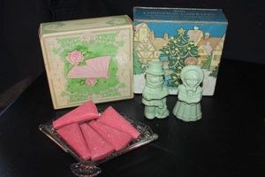 lot 364 image: Two Vintage Avon collectible sets, Christmas Carollers, soap Figurines in green, and Pink fan soaps with Glass Soap plate