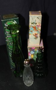 lot 367 image: Three Vintage Avon Decanter Bottles, with original boxes. Emerald Bud vase, Collectible Clear Glass 2oz perfume bottle with lid, Yuletree Moonwind cologne bottle