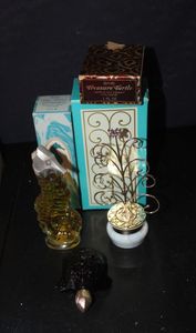lot 368 image: Two Vintage Avon Collectible bottles with Original boxes. 1970s Keepsake Cream Sachet Set Featuring a glass jar with a gold tone jewelry tree lid and its original box, Sea Horse decanter, Amber Colored glass with plastic hid, and original box