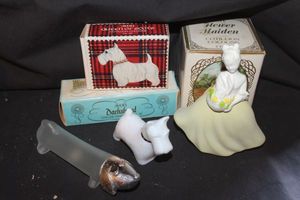 lot 370 image: Three Vintage Avon decanters with original boxes, Queen of Scots Milk glass Scottish Terrier Cologne, bottle. Flower Maiden 1970s originally contained Unforgettable, Clear Glass dog