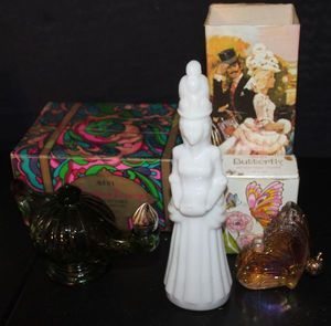 lot 375 image: Three Vintage Avon Decanter Bottles Butterfly, Milk glass decanter bottle with lld and&nbsp Green Genie in a bottle all with orginal boses